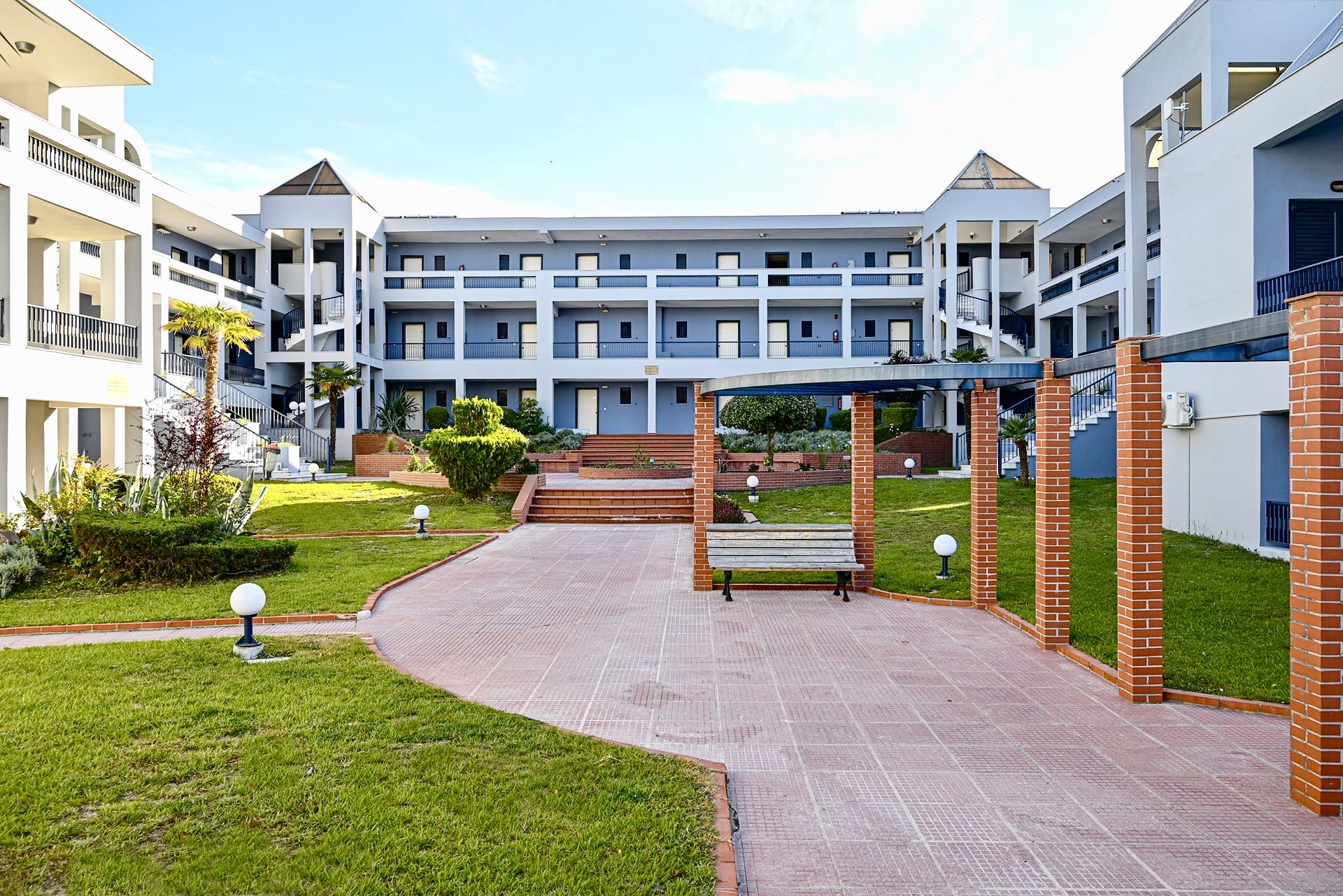 Atrium Hotel buildings among landscaped gardens