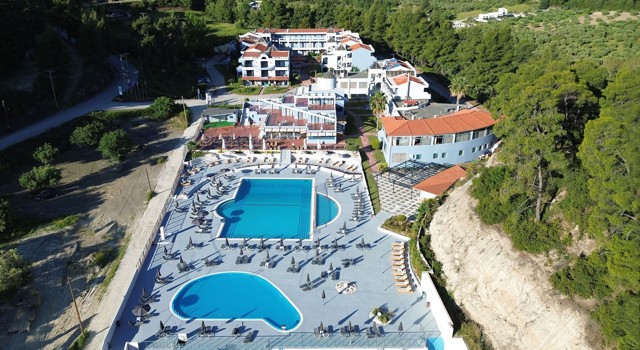 Hotel and pools surrounded by greenery