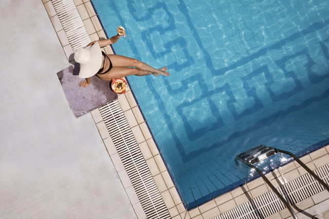Swimmer in the pool viewed from above
