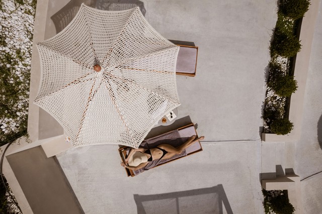 Pool umbrellas and sun loungers viewed from above